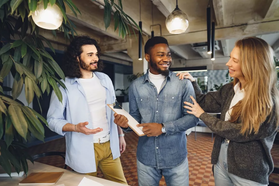 A team welcoming a new colleague