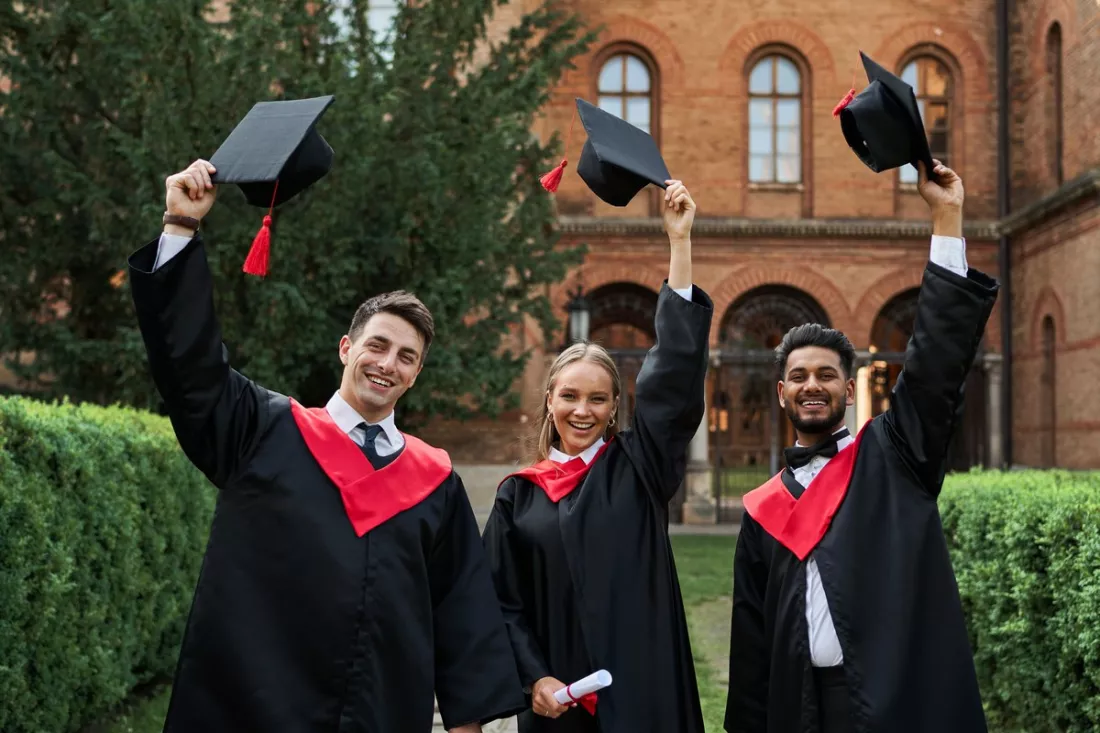 International graduates celebrating on campus